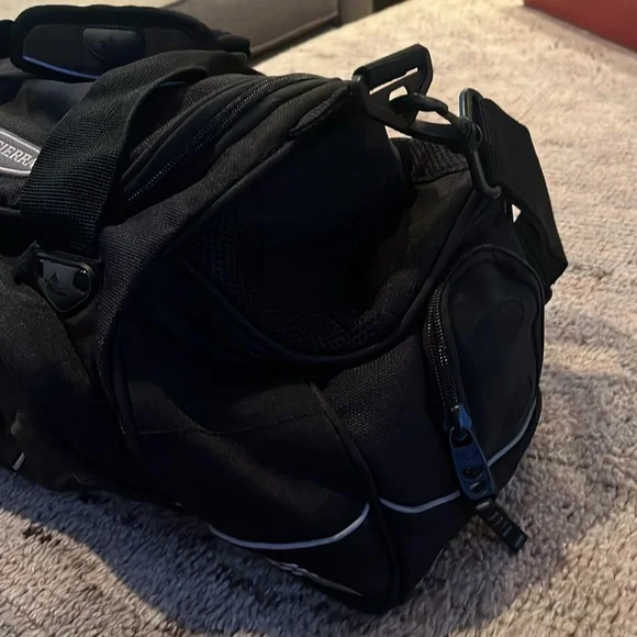 High sierra sports illustrated small duffle bag with strap.New - black color